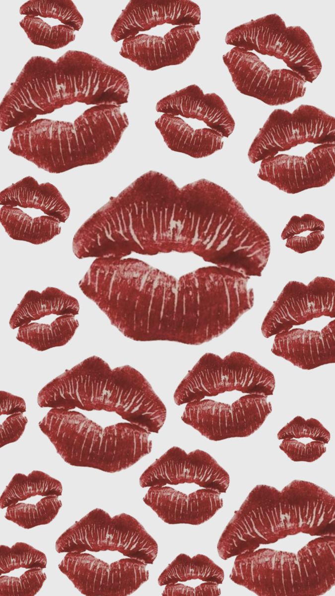 red lipstick kisses drawn on white paper