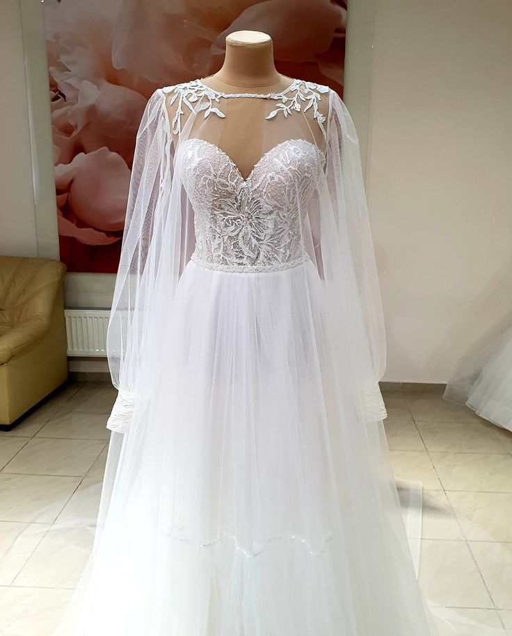 a wedding dress on display in a store