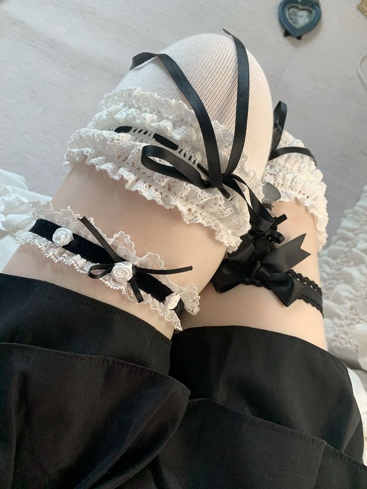 Elevate your lingerie collection with our black and white floral design sweet bowknots lace garter. This delicate and feminine garter features a charming floral design and sweet bowknots, adding a touch of romance to any outfit. The lace detailing exudes a sense of elegance and allure, making it a perfect choice for special occasions or to simply add a hint of glamour to your everyday wear.  Please note that this product includes only one garter.  Garment Size   	 		 			Size 			S 			M 		 		 			T Black Lace Stockings With Lace Trim, Elegant Black Lace Stockings, Black And White Cute Aesthetic, Thigh Garter Outfit, Garter Outfits, Garter Outfit, Thigh Garters, Bsd Oc, Thigh Jewelry