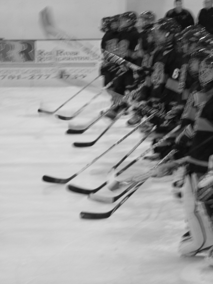 the hockey players are lined up on the ice waiting for their turn to play against each other