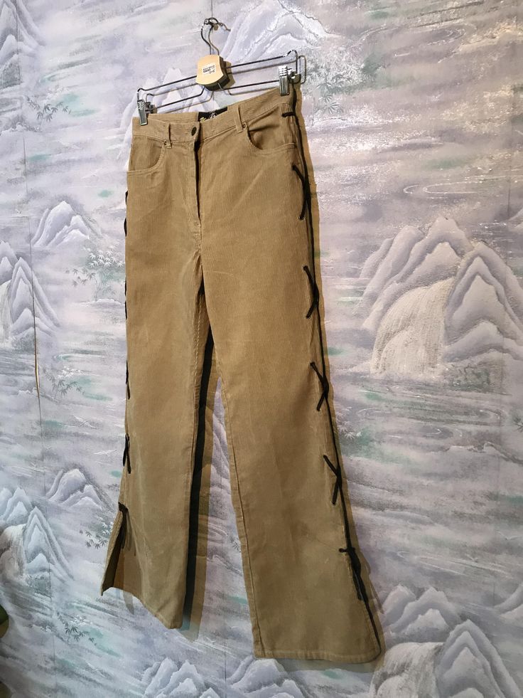 "Baggy Corduroy Pants Corduroy Trousers Boyfriend Pants Brown Sand Corduroy Pants Cowboy style pants Small Size Pants Label size: W32 ; L27 Measurements: (lying flat): Waist: 14\"- 35 cm Hips: 19\"- 48 cm Pant leg inseam: 31,5\" - 80cm Length: 41,5\" - 105 cm Please check measurements to insure a proper fit. Remember to allow yourself some extra room for movement. You can compare these with something from your closet that fits you well. This pants will come to you freshly laundered and ready to Casual Velvet Bottoms For Spring, Beige Straight Leg Corduroy Pants, Straight Leg Corduroy Pants For Spring, Casual Straight Leg Velvet Pants, Casual Velvet Straight Leg Pants, Vintage Corduroy Trousers, Beige Straight Leg Corduroy Bottoms, Trendy Straight Leg Corduroy Pants, Vintage Straight Leg Corduroy Pants