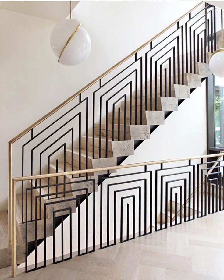 an elegant staircase with black and white designs