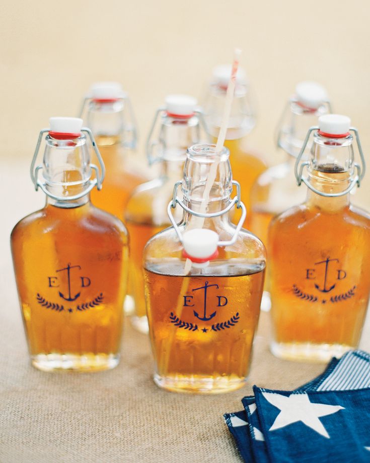 several small bottles filled with liquid sitting on top of a table