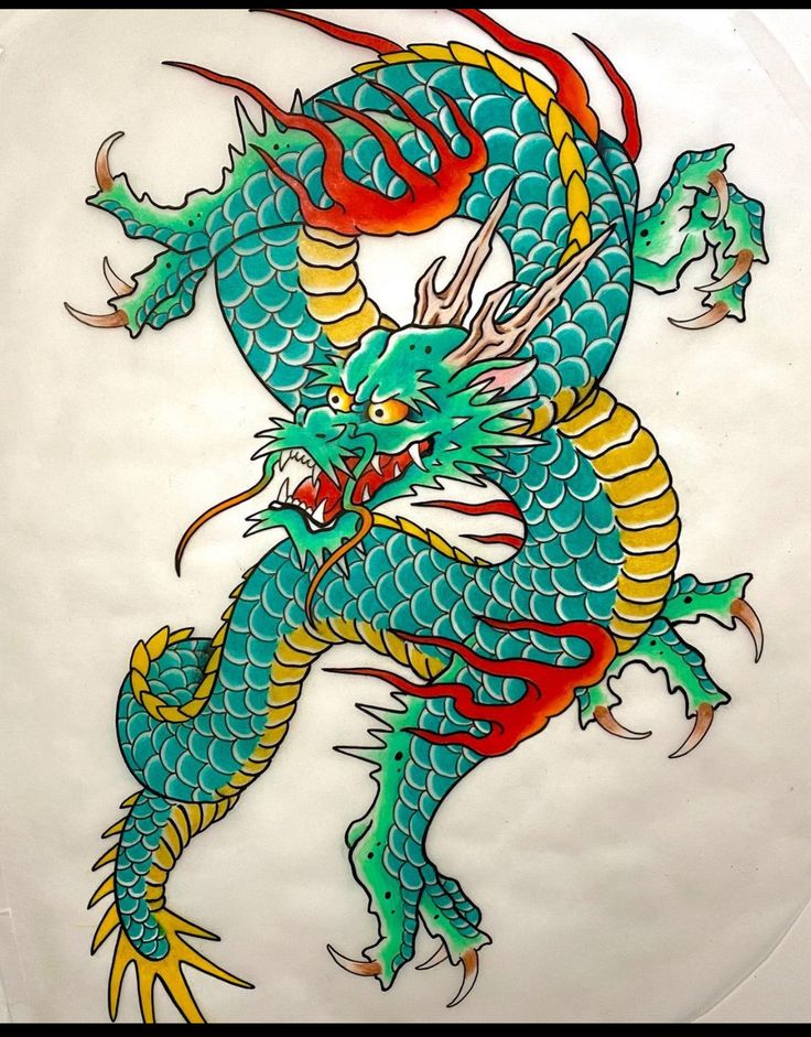 a blue and yellow dragon is on a white plate with red trimming around it