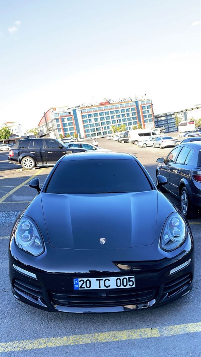 a black sports car parked in a parking lot