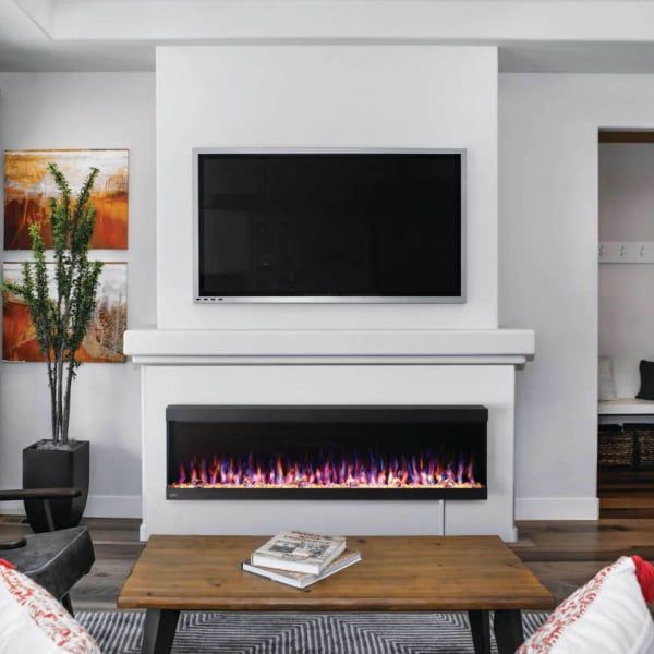 a living room with a fireplace and television mounted on the wall