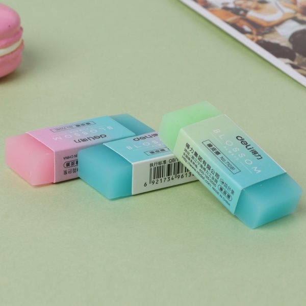 three erasers sitting next to each other on a table