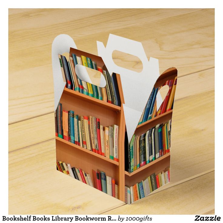 an open bookcase with books in it on top of a wooden table next to a white bag