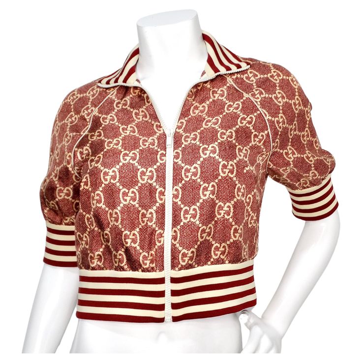 The Gucci GG Supreme Silk Burgundy Track Jacket, circa 2022, is a luxurious and stylish piece that perfectly blends athleisure with high fashion. Crafted from 100% silk and made in Italy, this jacket features Gucci's iconic GG Supreme pattern in a rich burgundy and cream color palette. The striped waist hem, collar, and sleeve hems in the classic track style add a sporty yet refined touch. With its quarter sleeve length, this jacket offers a modern silhouette that is both comfortable and chic. I Luxury Gucci Women's Blouse, Luxury Long Sleeve Gucci Blouse, Gucci Jacket Women Outfit, Gucci Tracksuit Women, Gucci Outfits Women, Gucci Tracksuit, Jacket Outfit Women, Gucci Jacket, Bodycon Tops