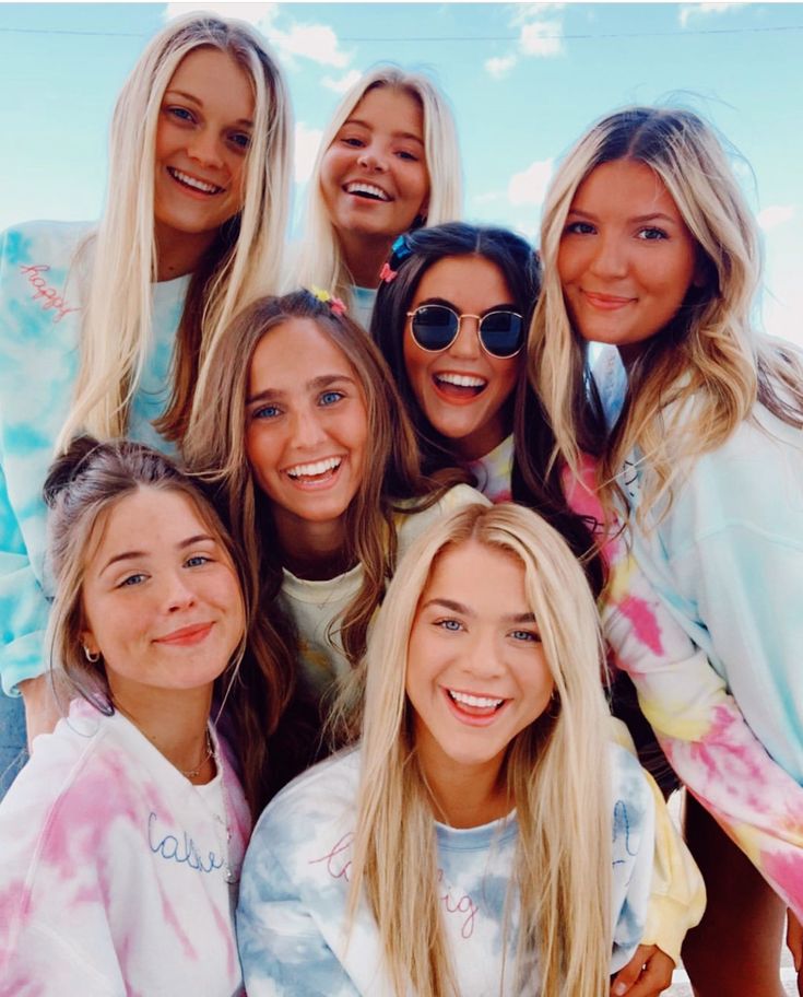 a group of young women standing next to each other