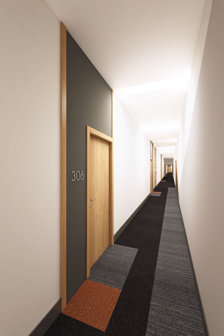 the hallway is clean and ready for guests to use it as a hotel or office