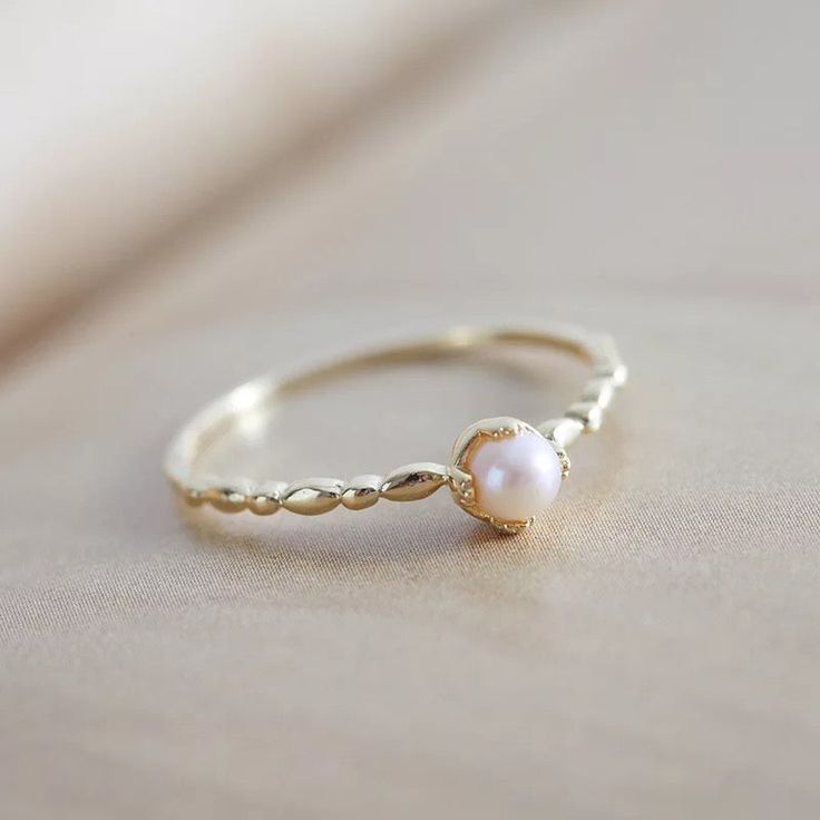 Luxury Handmade Pearl Promise Ring, Heirloom Gold Pearl Rings, Gold Pearl Birthstone Ring, Gold Pearl Promise Ring In 14k Gold, Dainty Gold Pearl Ring With Birthstone, Heirloom Gold Pearl Ring With Birthstone, Elegant Adjustable Tiny Pearl Ring, Heirloom Pearl Ring As A Gift, Heirloom Pearl Ring Gift