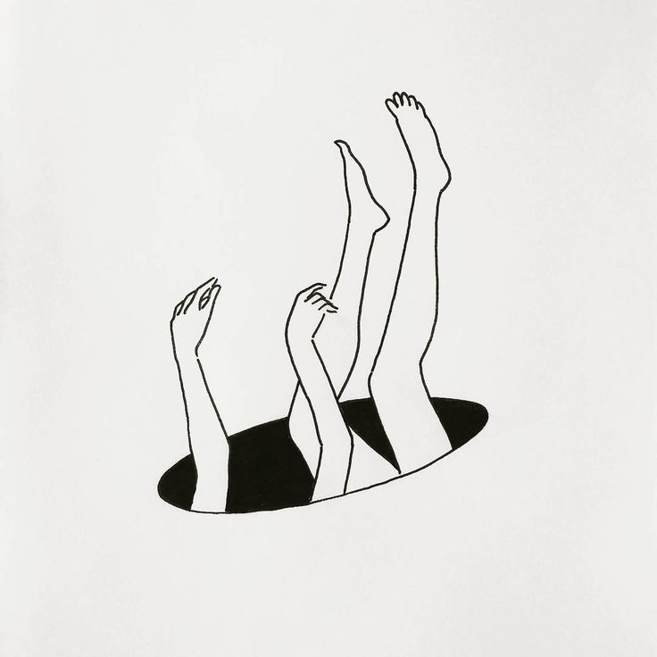 three people laying on top of each other with their hands in the air above them