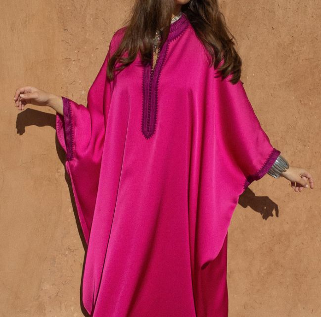 Experience the grace of Moroccan fashion with our Oversized Crepe Kaftan in the charming Pink hue. This kaftan is a masterpiece that seamlessly combines tradition and modernity, offering both style and comfort.   Product Details:      Oversized Crepe Kaftan with Handmade Embroideries : This kaftan is adorned with exquisite handmade embroideries, showcasing the artistry of Moroccan craftsmanship and adding an elegant touch to your look.     Off-White Handmade Embellishments : Delicate off-white h Oversized Elegant Kaftan, Elegant Pink Kaftan With Kimono Sleeves, Abaya Fashion Dubai, Moroccan Clothing, Modest Casual Outfits, Floral Chiffon Maxi Dress, Kaftan Designs, Mode Kimono, Moroccan Fashion