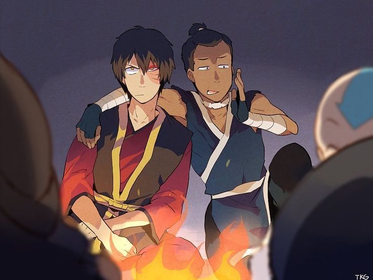 two men standing next to each other in front of a fire with their arms around one another