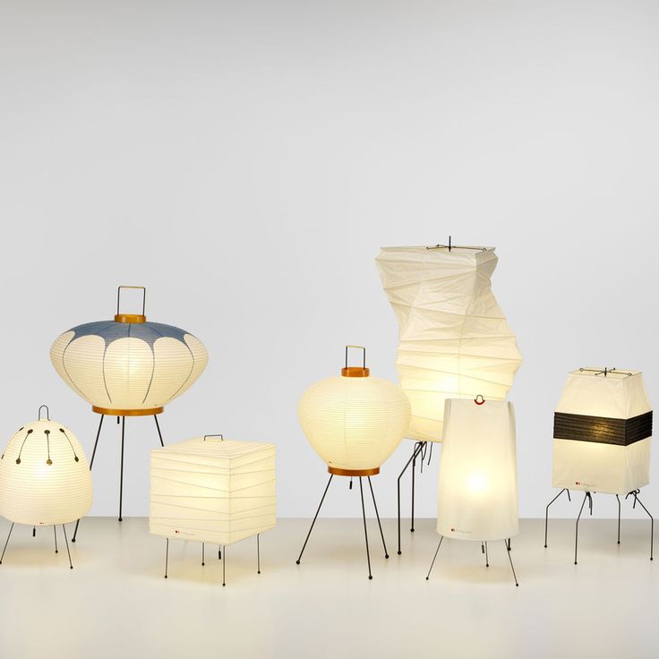 many lamps are arranged in rows on the floor, with one lamp turned upside down