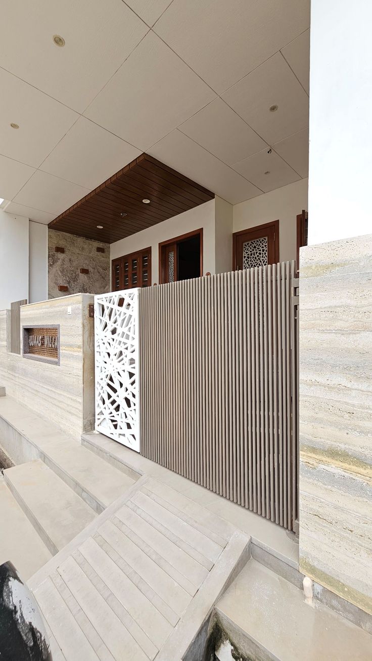 a white building with wooden slats on the outside