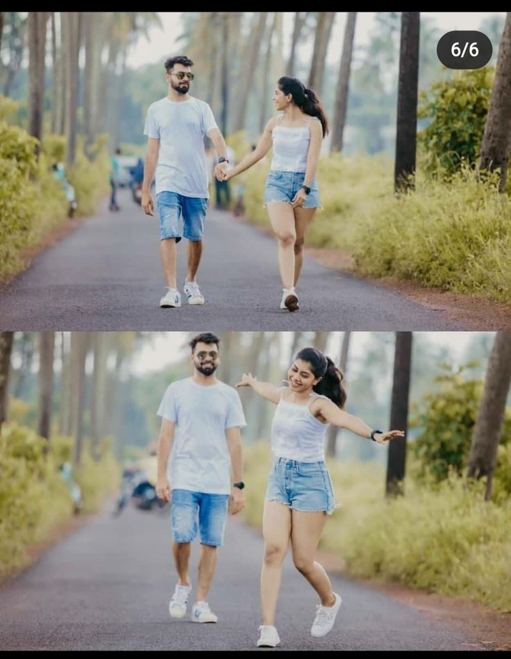 two people holding hands walking down a road with trees in the background and one person wearing white