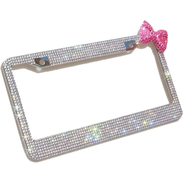 a metal license plate with a pink bow on the front and silver sequins