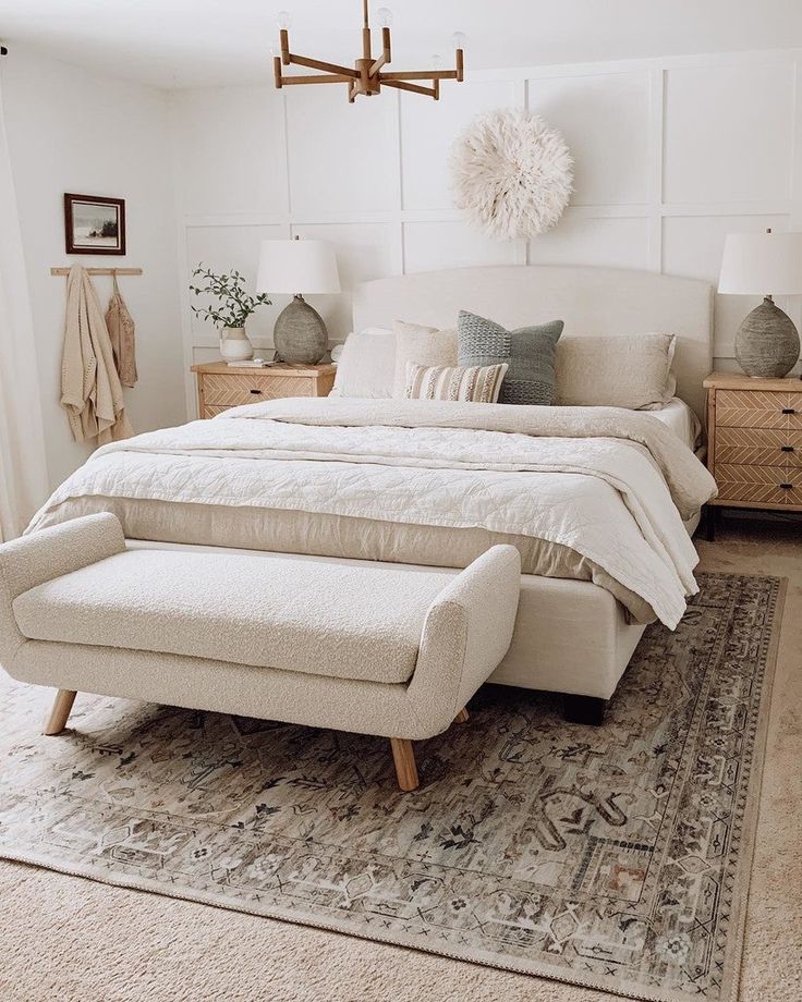 a large bed sitting on top of a rug in a bedroom