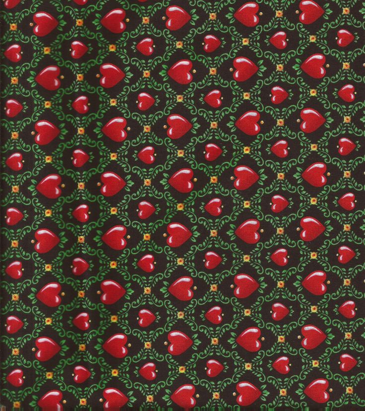 an apple pattern is shown in red and green on a black background with gold accents