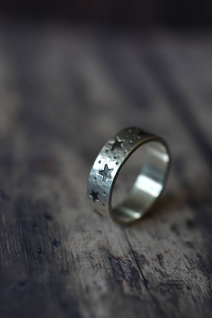 Hammered chunky unisex ring made from sterling silver. The texture and stars are made by hand and gives organic look to this ring. Every ring is unique and one of the kind. Minimalistic design is perfect for everyday wear. Could be personalised with hand stamped message inside. The width of the ring is 6 mm and thickness 1,2 mm. Oxidized finish to accentuate the stars. If you would like us to stamp a secret message inside your ring, please, don't forget it to add it as a note to seller. You coul Thick Silver Rings, Silver Mens Rings, Rings Star, Ring Moon, Stamped Ring, Measure Ring Size, Space Jewelry, Moon And Star Ring, Stamped Rings