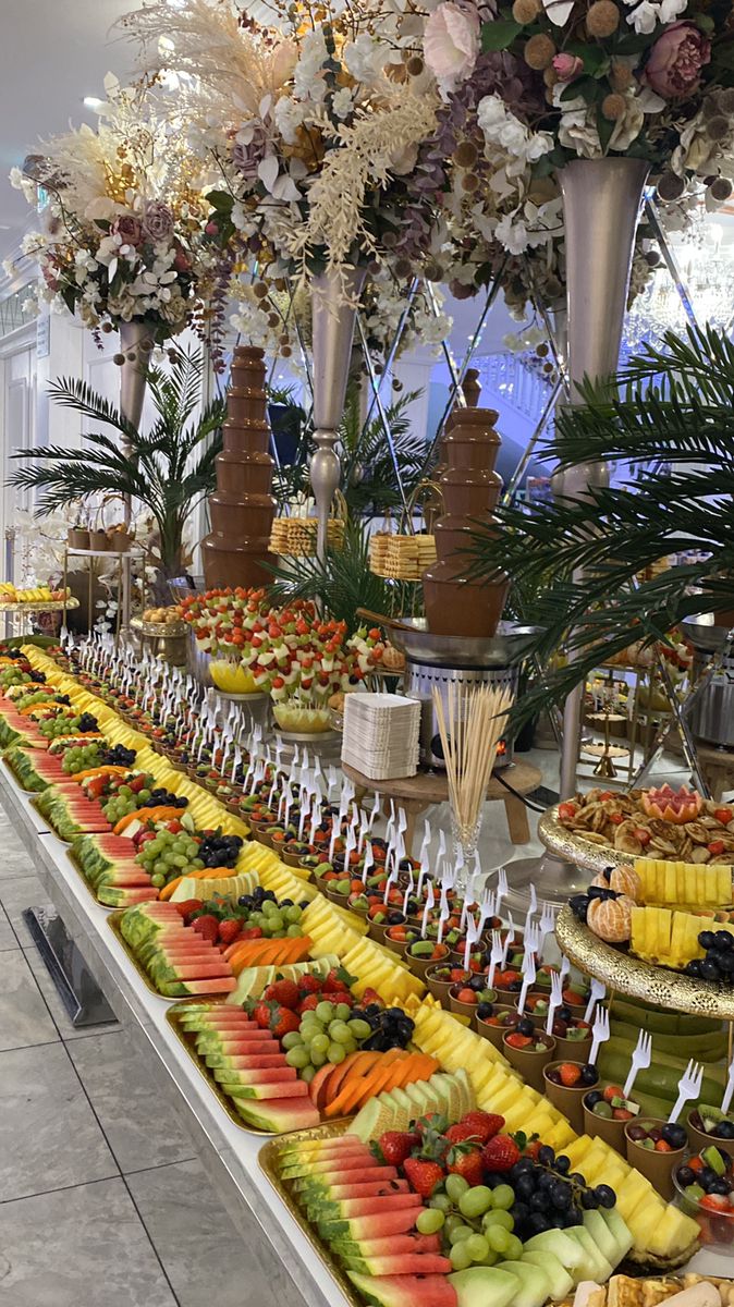 an assortment of fruits on display in a buffet