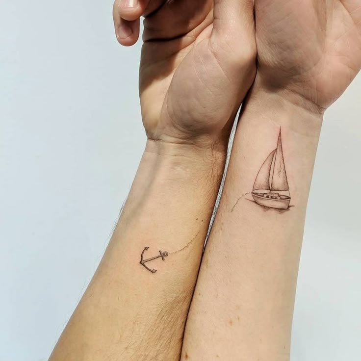 two people with matching tattoos on their arms