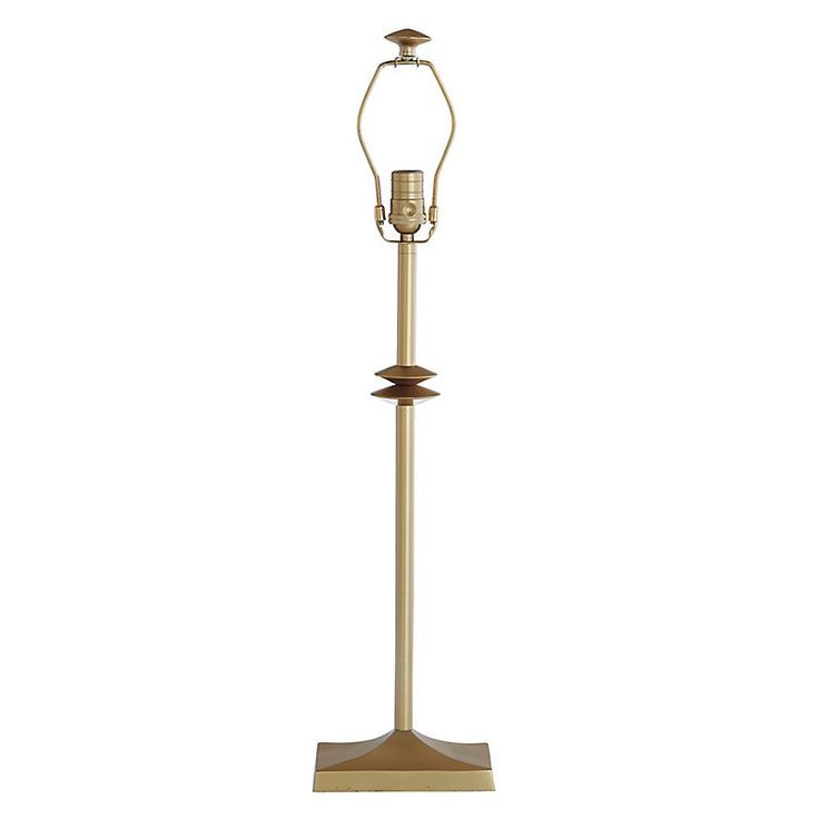 a lamp that is on top of a stand with a light bulb in the middle