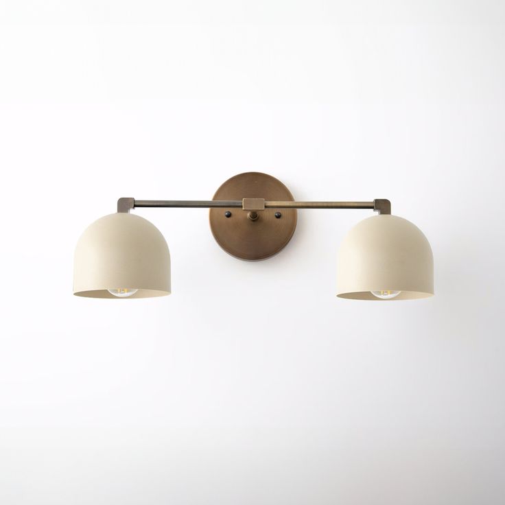 two light fixtures mounted on a wall