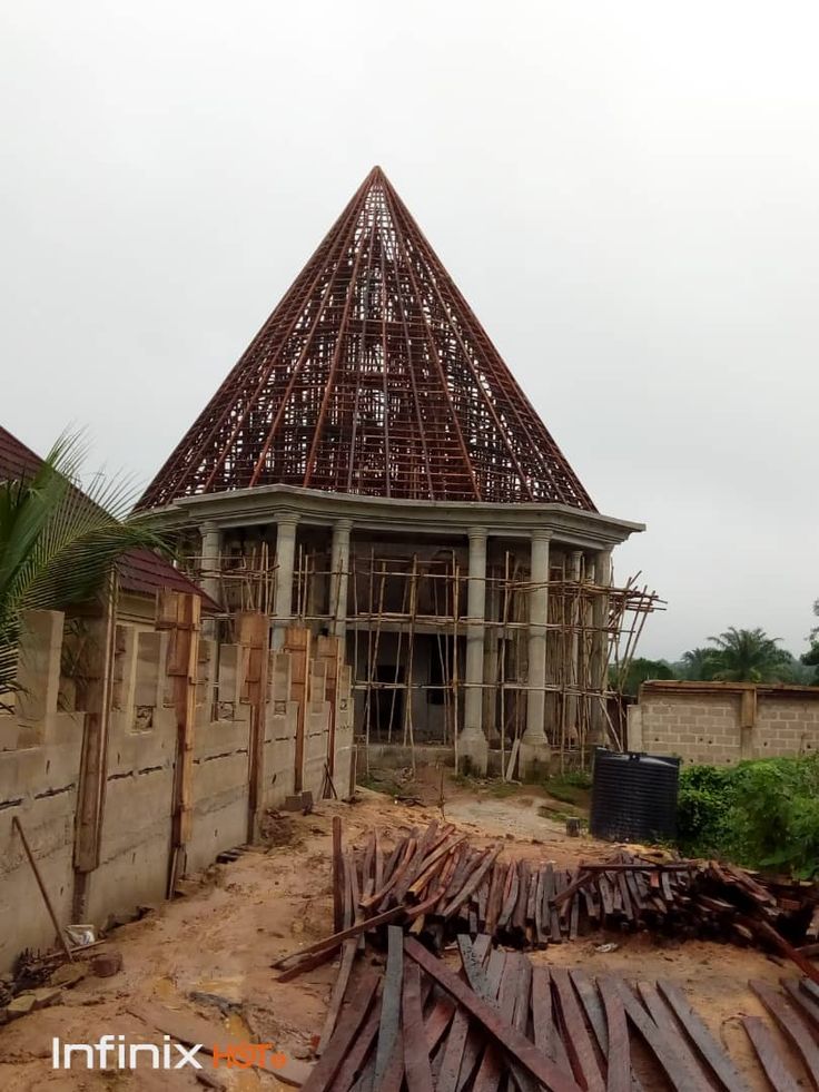 a house under construction in the middle of an area that is being built on land