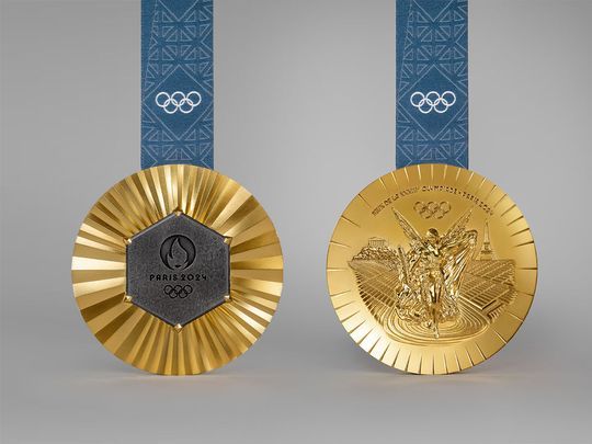 two gold and silver medals with blue ribbons on each side, one for the olympic games