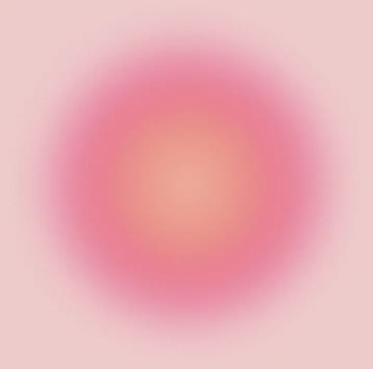 an orange and pink circle on a light blue background with some white dots in the center