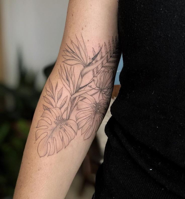 a woman with a tattoo on her arm