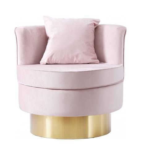 a pink and gold chair with pillows on it