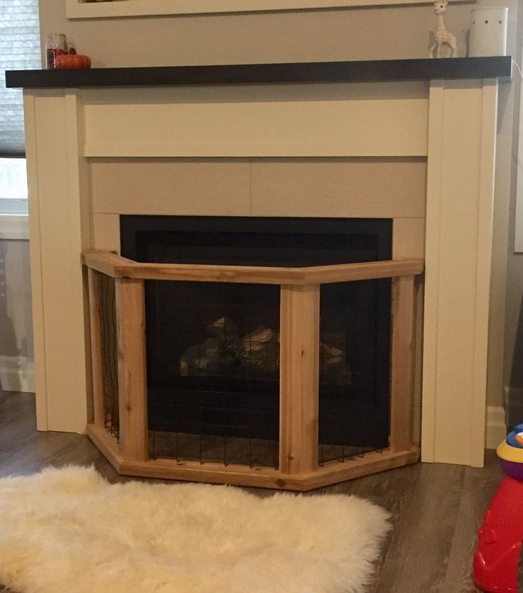 a living room with a fire place and rug on the floor