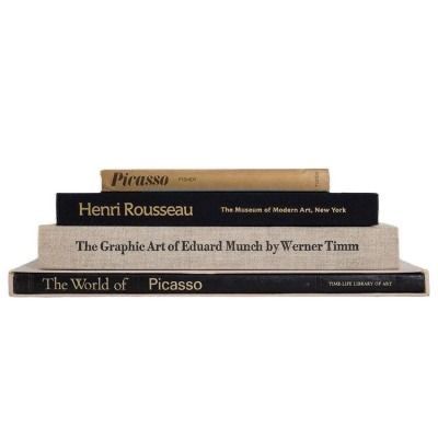 three books stacked on top of each other in front of a white background with the words, henry rousseau and the graphic art of edward mundu by walter timm