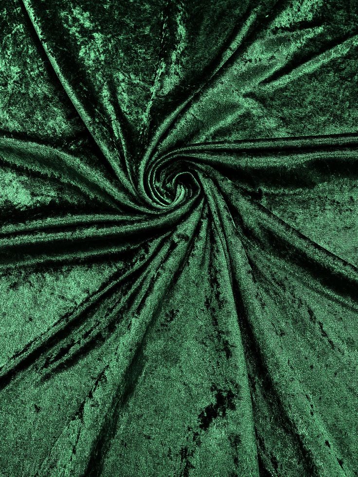 an image of a green velvet fabric that looks like it is going through the center