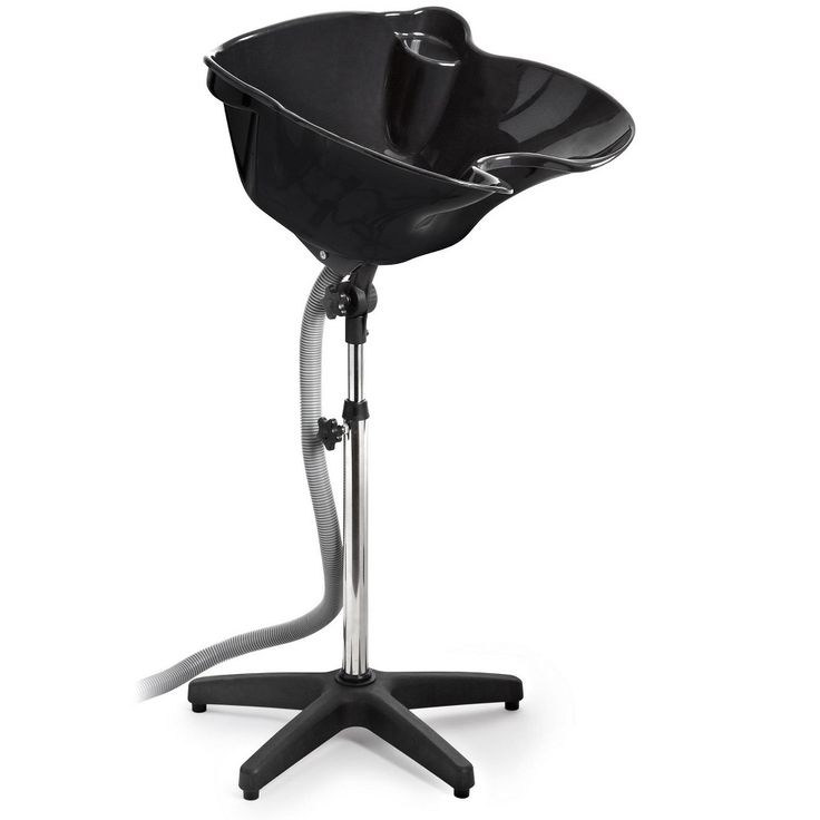 a black chair sitting on top of a metal stand