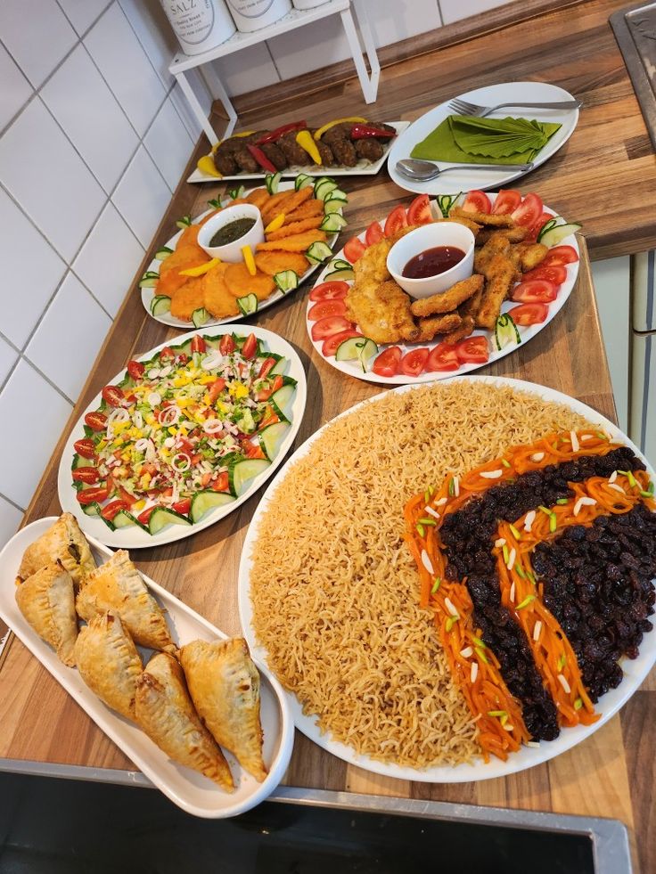 a table topped with plates filled with different types of food