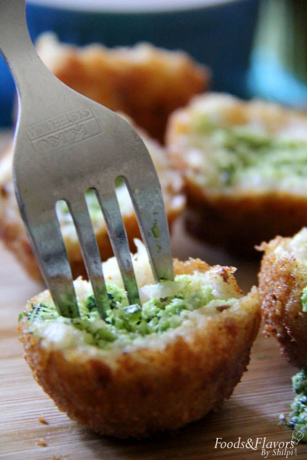 a fork is stuck into some food on a cutting board