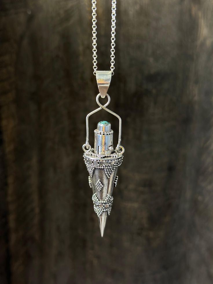 Includes a 925 solid silver 18" cable chain. Introducing our latest addition to our collection - the Mystic Vial Pendulum Necklace! This stunning piece of solid 925 silver jewelry is not only visually appealing, but also functional - it allows you to carry your favorite essential oils, herbs, notes, or even ashes with you wherever you go. Crafted with the finest quality materials, including a solid silver delicate yet sturdy 18" chain and a vial that securely holds your chosen materials, this pendulum necklace is not only beautiful but also practical. The pendulum is carefully designed to help you access your inner wisdom and intuition, making it perfect for anyone who enjoys divination practices or spiritual rituals. The Mystic Vial Pendulum Necklace is a unique and versatile accessory th Spiritual Rituals, Pendulum Necklace, Dope Jewelry Accessories, Vial Necklace, Essential Oil Necklaces, Witch Necklace, Essential Oils Herbs, Inner Wisdom, Magical Jewelry