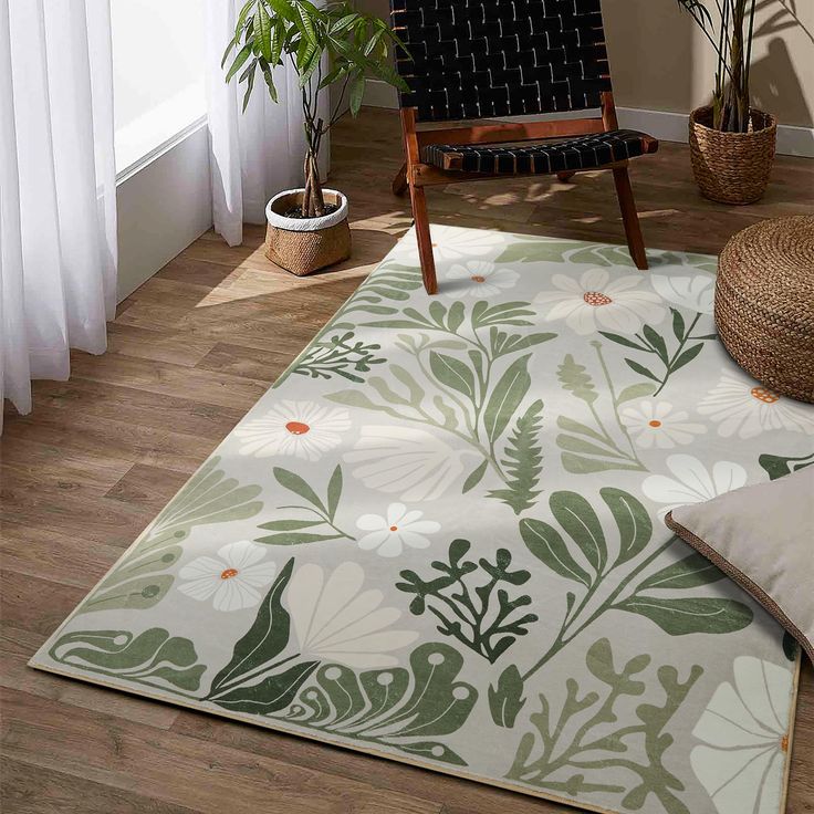 a living room area with a chair, rug and potted plants on the floor