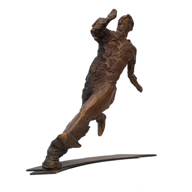 a bronze statue of a man catching a frisbee in mid air with his arm outstretched