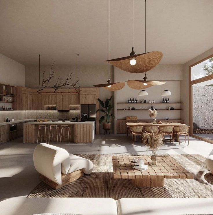 a living room filled with furniture and lots of lights hanging from the ceiling next to an open kitchen