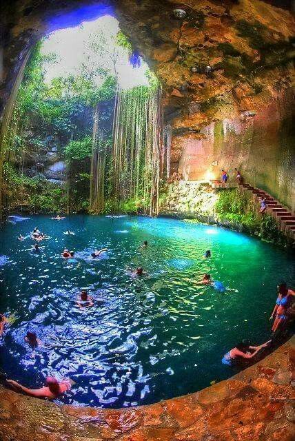 people are swimming in the blue pool at chichen tiza, yucaten, mexico