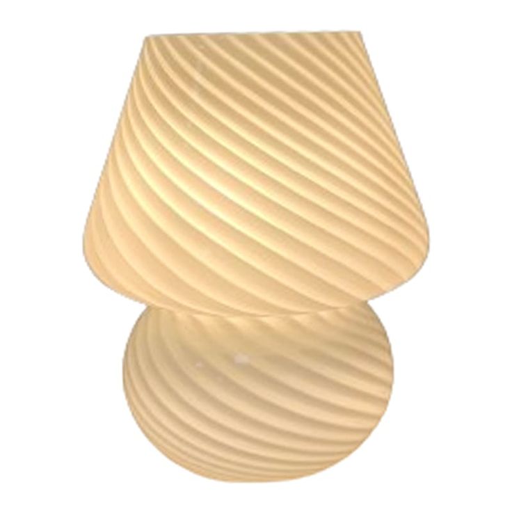 a lamp that is sitting on top of a white wall mounted light fixture with wavy glass shades