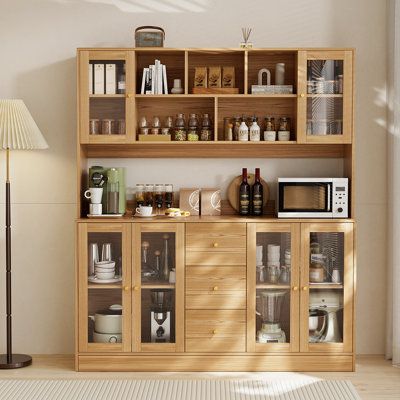 a wooden shelf filled with lots of kitchen items