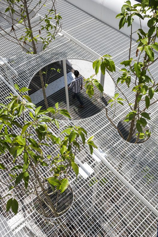 an instagram photo taken from the top of a building with trees and people in it