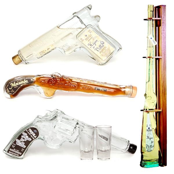 three different types of liquor bottles and glasses next to a wooden stick with two shots in it